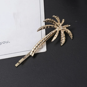 Elegant gold-plated alloy palm tree hair clip with detailed leaf texture on base