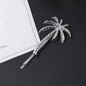 Polished silver alloy hair clip featuring a creative palm tree design for women's styling