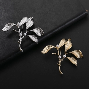Elegant gold and silver leaf brooches with white pearls and textured matte finish