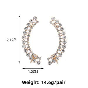 Detail view of rhinestone curved drop earrings with measurements 5.3cm length and 1.2cm width