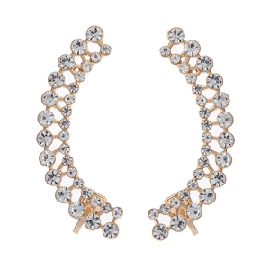 Detail showing gold curved ear cuffs with sparkling crystals in a hollow grid design
