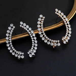 Elegant C-shaped ear cuffs with pavé-set rhinestones in silver and gold tones