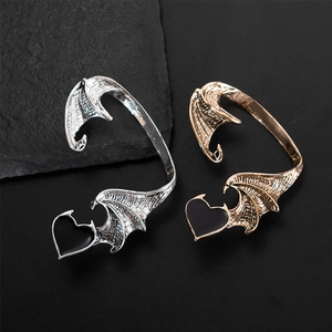Gothic dragon wing ear cuffs with black heart drops in silver and gold metal finish