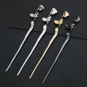 Minimalist geometric metal hair sticks in gold, silver, and black with wavy sculptural lines
