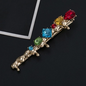 Barrette à cheveux dorée avec texture de lave et strass colorés étincelants