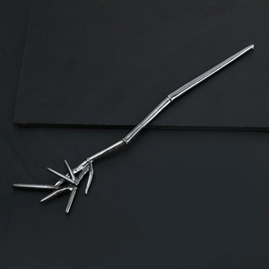 Bamboo style silver metal hair pin with natural leaf design for elegant updo hairstyles
