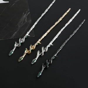 Gothic snake hair pins in gold, silver and black with green crystals and snake pattern