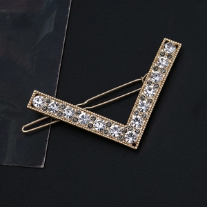 Vintage V-shaped gold metal hair clip with sparkling white rhinestones for women