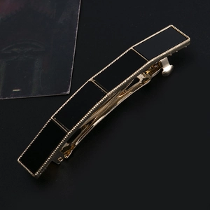 Elegant gold metal spring hair clip with four geometric black acrylic plates for women