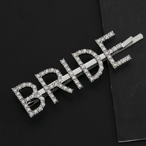 Elegant silver 'BRIDE' hair clip with sparkling rhinestones for weddings