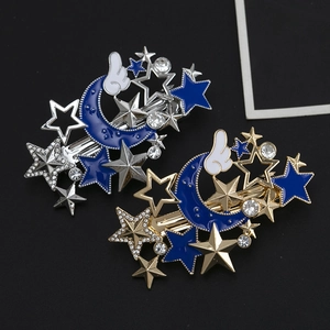 Elegante Mond und Sterne Haarklammern mit blauem Emaille und Strass auf schwarzem Grund