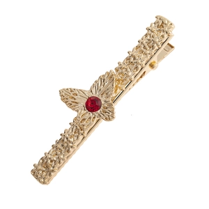 Golden butterfly hair clip with red gemstone and floral embossed alloy duckbill design