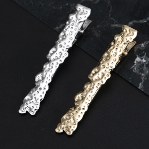 Minimalist alloy hair clip set with wavy lava texture in gold and silver finish