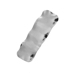 Minimalist silver wavy irregular hair clip with a high-gloss polished mirror finish