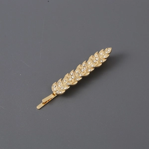 Elegant gold leaf hair clip with clear rhinestones in a feather design for women