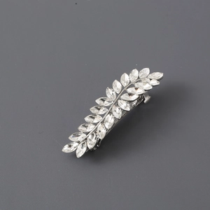 Exquisite silver leaf hair clip with marquise-cut rhinestones on dark grey background