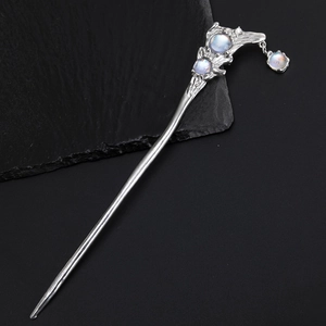 Vintage alloy hair pin with moonstone inlays and rock texture on black background