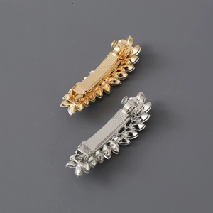 Elegant gold and silver hair clips with sparkling leaf-shaped crystal embellishments