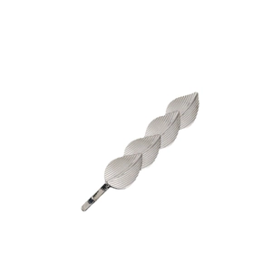 Minimalist silver metal leaf hair clip with detailed veins on a clean white background