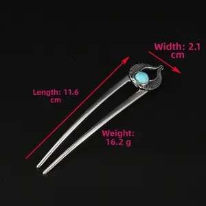 Detail view of U-shaped hair pin with dimensions 11.6cm length and turquoise stone