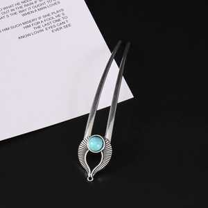 Vintage silver U-shaped hair fork with marble turquoise stone in ethnic sunburst design