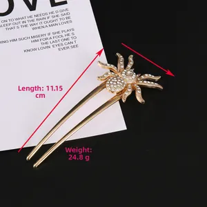 Detailed view of luxury gold spider hair pin featuring full white crystal inlay and dual prongs