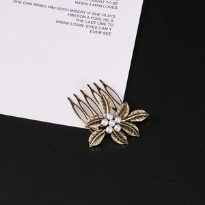 Vintage bronze flower hair comb with delicate leaves and white pearl bead accents
