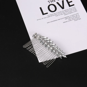 Elegant silver leaf hair comb featuring shimmering rhinestones for bridal hairstyles