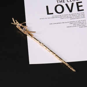 Vintage golden branch hair pin with colorful iridescent gems in a magic wand style