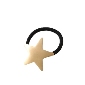 Minimalist elastic hair tie featuring a matte gold star charm and black durable rope