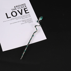 Gothic silver snake hair pin with green crystal accents for minimalist hair styling