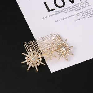 Macro detail of golden star hair comb with sparkling crystals on black background