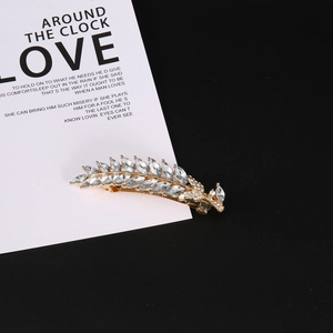 Elegant gold leaf hair comb with sparkling crystals and rhinestones for women