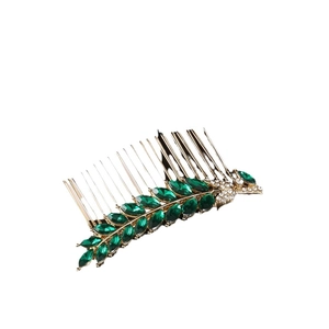 Vintage gold leaf hair comb with emerald green crystals and sparkling rhinestones