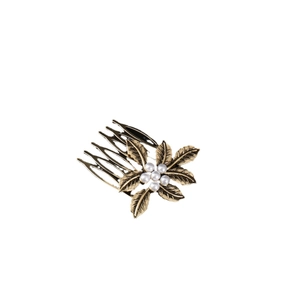 Elegant vintage gold hair comb with pearl flower and leaf patterns on a white background