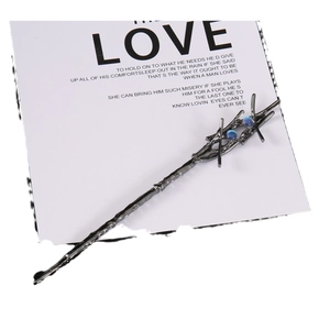 Gothic tree branch hair pin in dark grey metal with two blue opal stones and mystical style