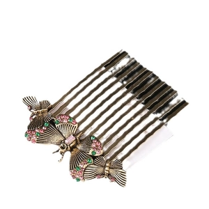 Vintage bronze butterfly hair comb with pink and green rhinestones and wavy tines