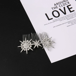 Detailed close-up of a three-piece starburst rhinestone hair comb set with silver plating