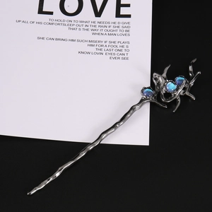 Irregular branch-shaped hair pin in gunmetal finish with blue iridescent opal stones