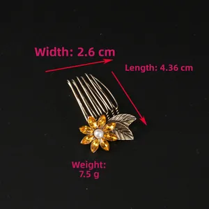 Detail view of flower hair comb with dimensions 4.36cm by 2.6cm and amber crystals
