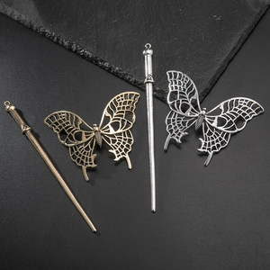 Ancient gold and silver hollow butterfly hairpins with textured metal pendants