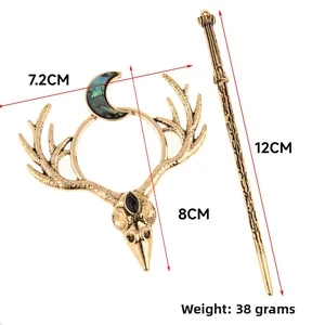 Detailed view of Gothic antler hair pin with crescent moon and dark gemstone accents