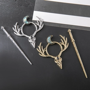 Gothic raven skull hair clip with crescent moon and antlers in gold and silver finishes