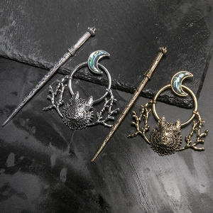 Gothic wolf head and crescent moon hair sticks in silver and bronze finish on black stone