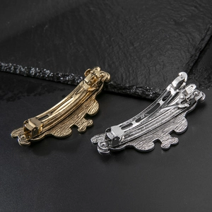 Vintage bronze gold and silver metal hair clips with abstract floral patterns and patterns