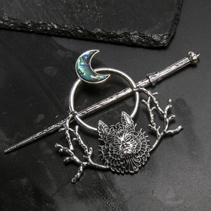 Gothic vintage silver hair stick with crescent moon and wolf head on black slate
