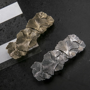 Vintage large metallic ginkgo leaf spring hair clip in antique gold and silver finishes