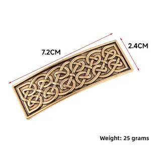 Macro detail of bronze vintage rectangular hair clip with Celtic knot patterns