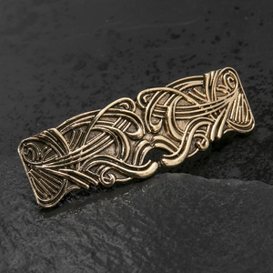 Macro detail of bronze retro hair clip with symmetric Celtic style metal texture
