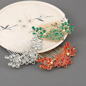 Close-up of vintage flower hair combs with sparkling rhinestones and white pearls